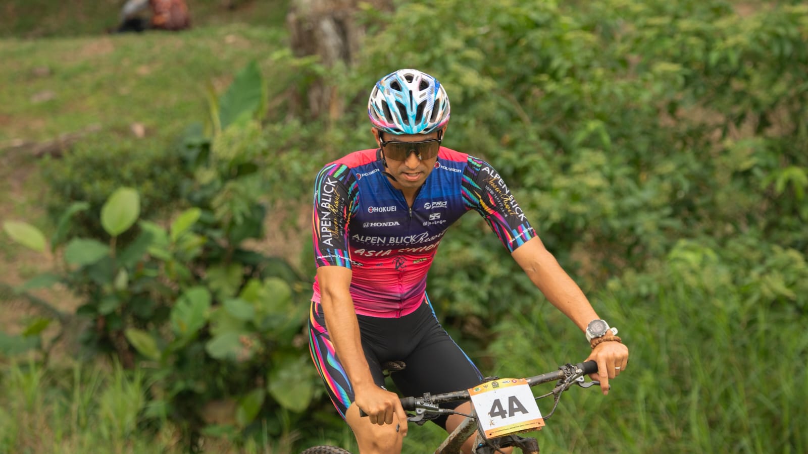 Mountain bike racer celebrating during an outdoor race.
